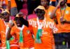 Ivory Coast fans support their national team during a World Cup soccer match.