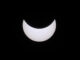 A black sky with a bright white moon.