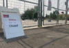 A closure sign in front of a fenced off splash pad