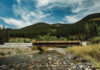 A low bridge over a mountain river.