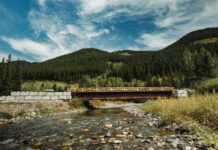 A low bridge over a mountain river.