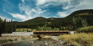 A low bridge over a mountain river.