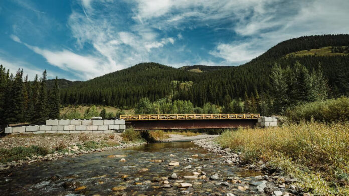 A low bridge over a mountain river.