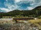 A low bridge over a mountain river.