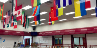 Flags are seen in a cafeteria.