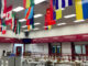 Flags are seen in a cafeteria.
