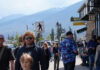 People on a street with mountains.