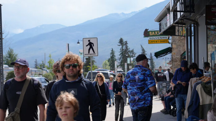 People on a street with mountains.