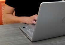 A 2023 file photo of someone working on a laptop.