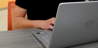 A 2023 file photo of someone working on a laptop.