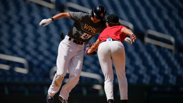 wbp01-featured Claire Eccles is seen getting tagged out during a game being played at Nationals Park in Washington, D.C., as part of a tryout for players wanting to be part of the Women's Pro Baseball League.