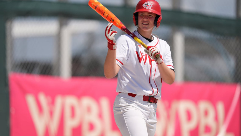 Canadian ballplayer Jaida Lee, holding a bat, while waiting to step up to the plate during a Women's Pro Baseball League exhibition game.