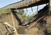 Horseshoe Creek 道路沖毀後　重建責任各方說法不一