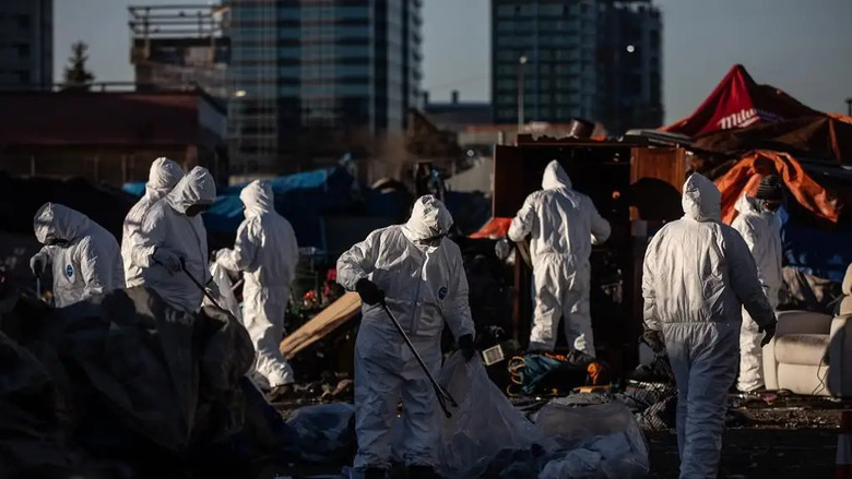 Cleanup crews tear down homeless encampments in Edmonton on Friday, Dec. 29, 2023.