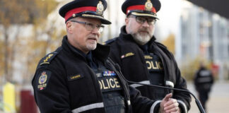 EPS Police Operations Chief Devin Laforce speaks about a reduction in crime and violence due to a focus on visible enforcement, during a press conference in Butler Memorial Park, Stony Plain Road and 158 Street, in Edmonton Wednesday Oct. 14, 2026. Photo by David Bloom