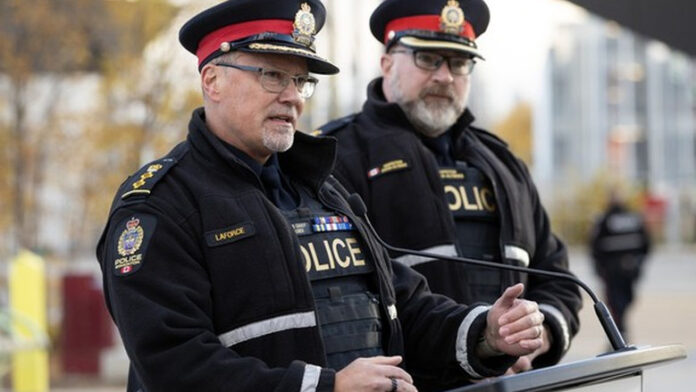 EPS Police Operations Chief Devin Laforce speaks about a reduction in crime and violence due to a focus on visible enforcement, during a press conference in Butler Memorial Park, Stony Plain Road and 158 Street, in Edmonton Wednesday Oct. 14, 2026. Photo by David Bloom