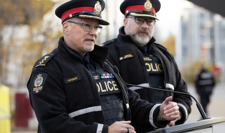 EPS Police Operations Chief Devin Laforce speaks about a reduction in crime and violence due to a focus on visible enforcement, during a press conference in Butler Memorial Park, Stony Plain Road and 158 Street, in Edmonton Wednesday Oct. 14, 2026. Photo by David Bloom