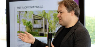 Greg Whistance-Smith, Project architect with City of Edmonton's Infrastructure Services leads a panel discussion about infill housing at Edmonton's Stanley Milner Library, Thursday Oct. 15, 2026. Photo by David Bloom