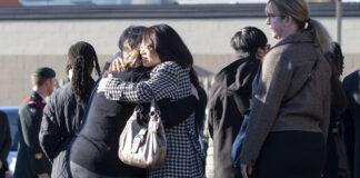 Mourners leave a funeral for Sgt. Morgan Wong at Park Memorial Funeral Home on Oct. 25 in Edmonton. Wong was one of the four Canadian Armed Forces members killed last week in the CFB Wainwright fire Photo by Greg Southam / 10113056A