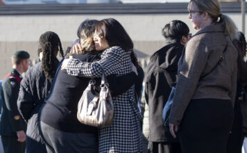 Mourners leave a funeral for Sgt. Morgan Wong at Park Memorial Funeral Home on Oct. 25 in Edmonton. Wong was one of the four Canadian Armed Forces members killed last week in the CFB Wainwright fire Photo by Greg Southam / 10113056A
