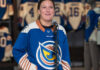 The Vancouver Goldeneyes' Jenn Gardiner is seen with the team's new jersey for the upcoming 2026-27 season on Wednesday. (Hunter Soo/CBC) 圖片來源：Hunter Soo/CBC